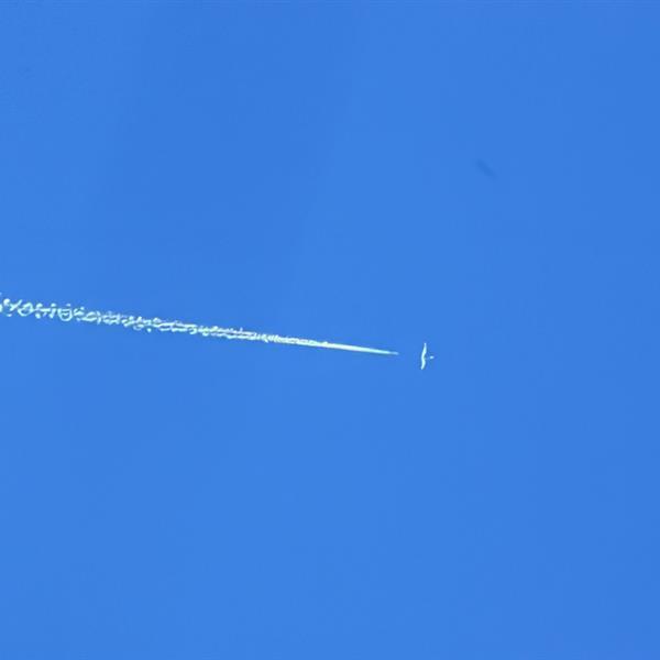 the trail of an airplane in the sky