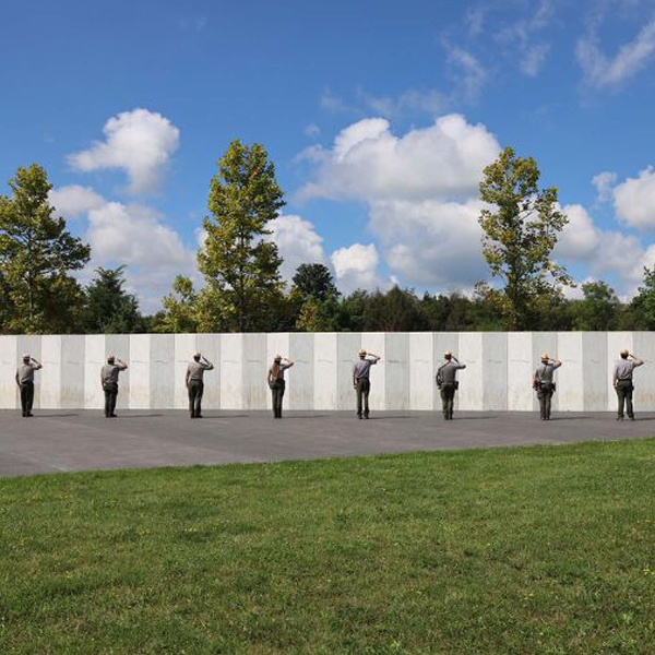 Soldiers lined up saluting the Flight 93 Memorial